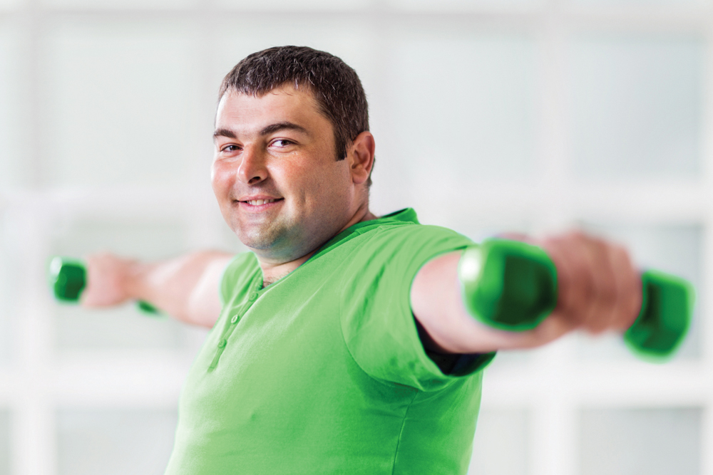 man lifting weights