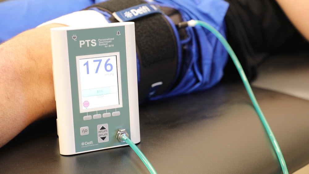 Blood Flow Restriction Delfi Unit on Patient