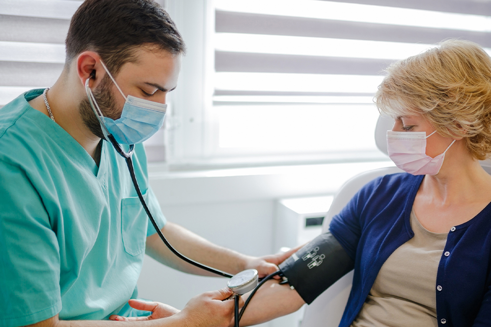 medical assistant checking vitals