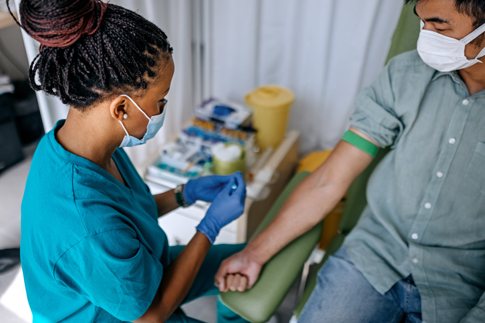 phlebotomist preparing for blood draw